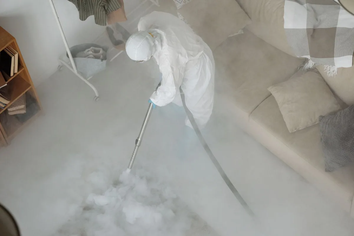 Biohazard cleanup technician in protective equipment, Senatobia, MS